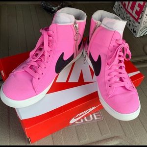 Pink high top Nike shoes